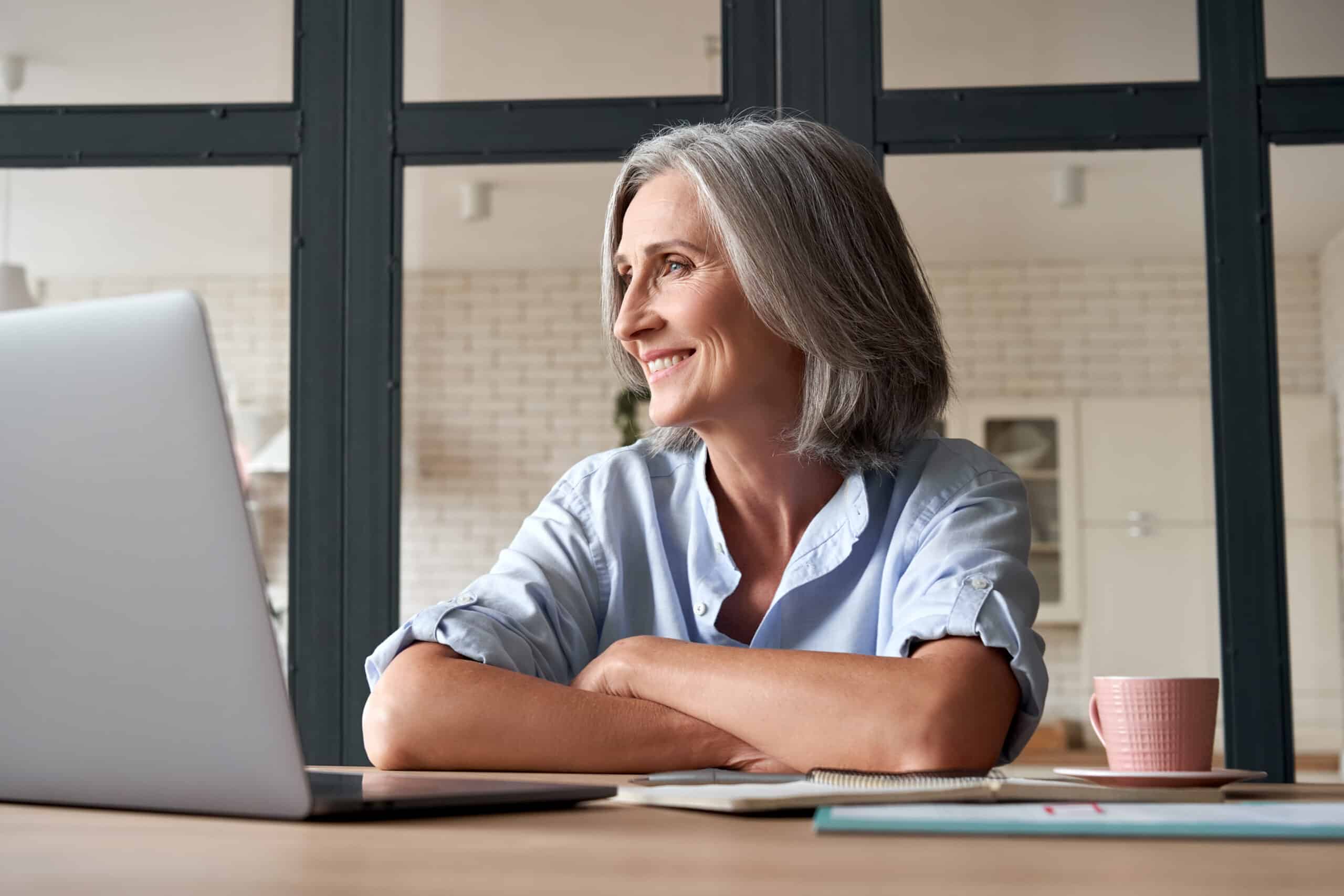 Smiling,Stylish,Mature,Middle,Aged,Woman,Sitting,At,Home,Office