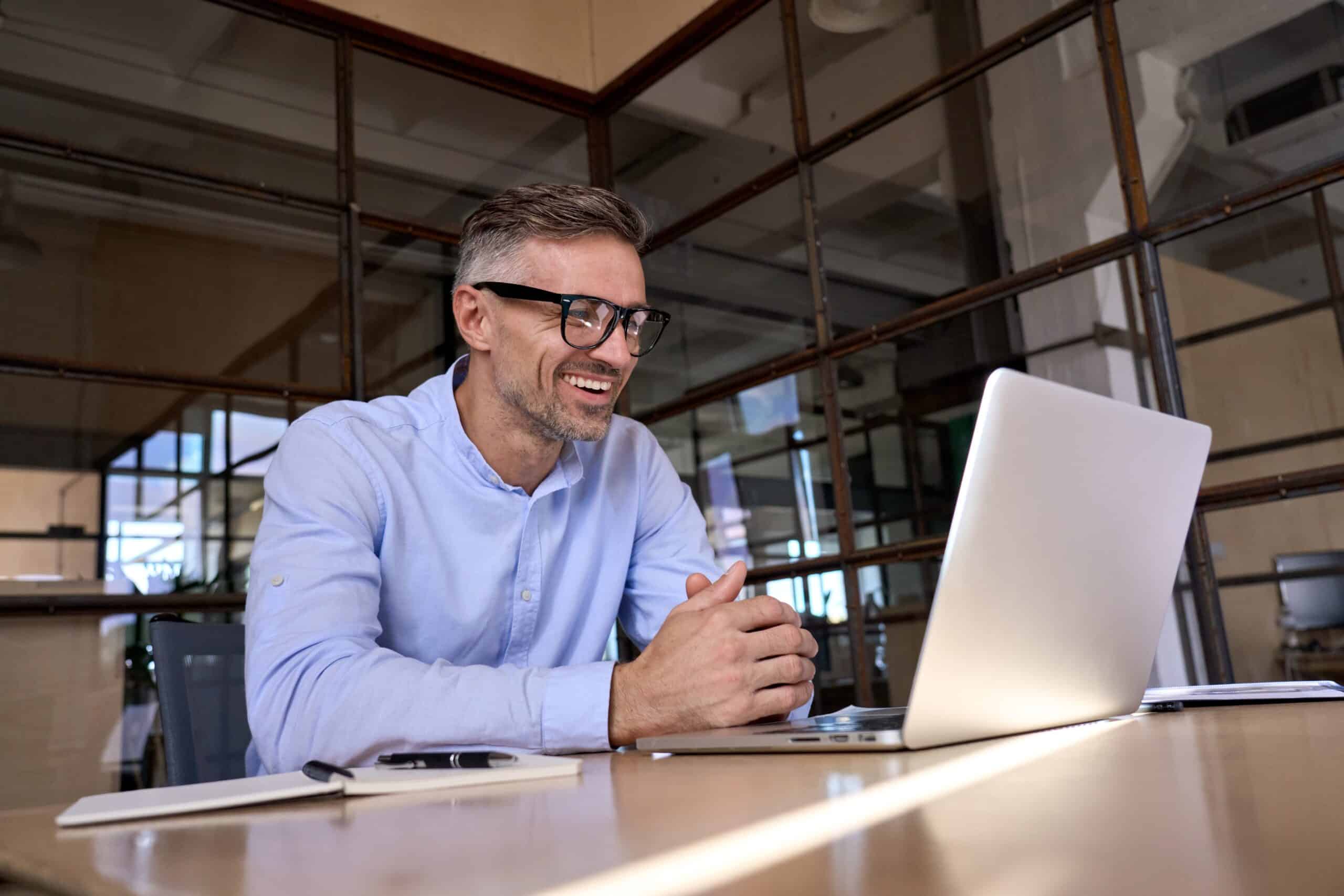 Happy,Mature,Business,Man,Executive,Manager,Looking,At,Laptop,Computer